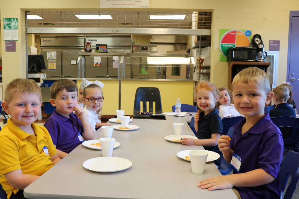 Preschool students enjoy a snack