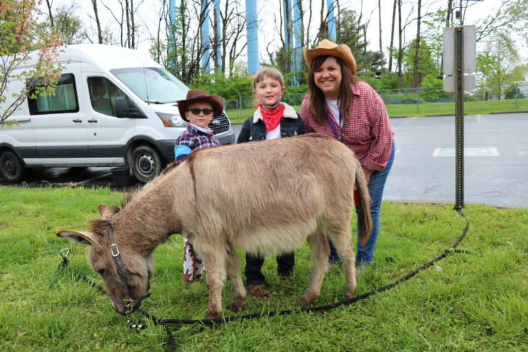 Principal Sharp and students enjoy a visit from Honeyhill Farm